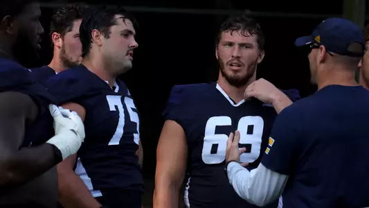 Harrison Moon & Cole Strange listen to direction from Coach Tommy Galt.