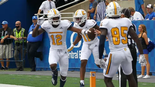 Reggie Henderson celebrates his 2nd TD of the season with Tyron Arnett (11) & Tyler Smith (85).