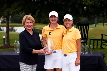 Esme Hamilton and Dorota Zalewska accept the runner-up trophy at the Mercedes-Benz Collegiate.