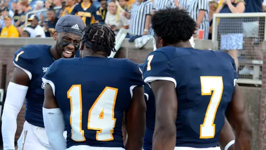 Brandon Dowdell celebrates with teammates after an interception.