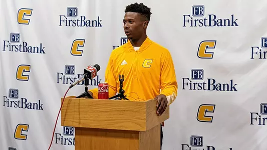 Kam Brown talks with the media.