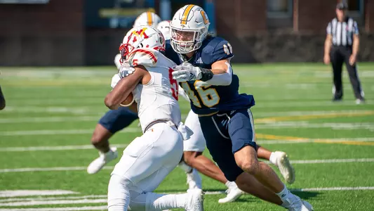 Ty Boeck stuffs a VMI runner.
