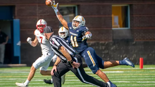 Alex Mitchell breaks up a VMI Keydets pass
