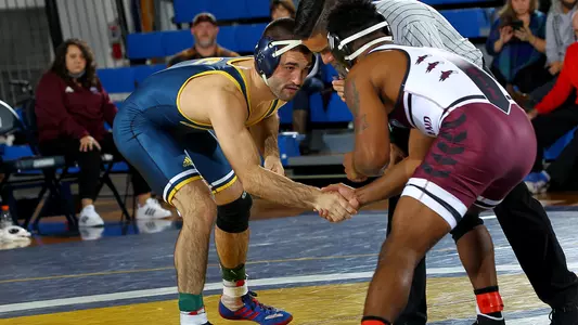 Grant Lundy shakes hand with an opponent prior to starting the match.