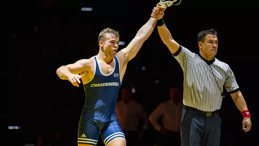 Rocky Jordan gets his hand raised for his win over Iowa