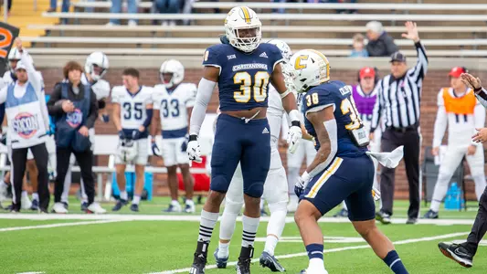 Jay Person celebrates a sack with Austin Collier against Samford