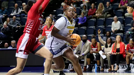 Raven Thompson powers to the basket for a layup.