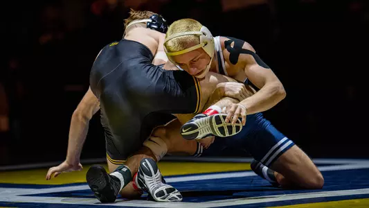 Brayden Palmer wins a closely-contested battle over Iowa
