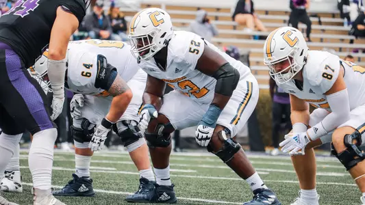McClendon Curtis lined up between Reid WIlliams and Jay Gibson awaiting the snap at Furman