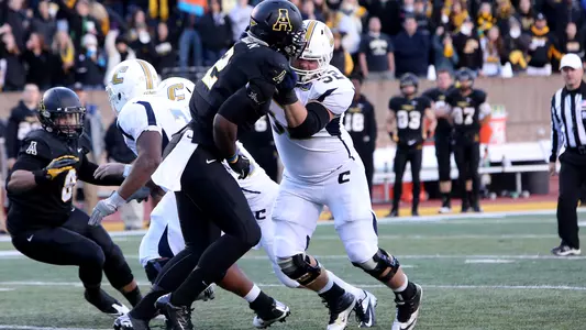 Kevin Revis drives through a defender at App State.