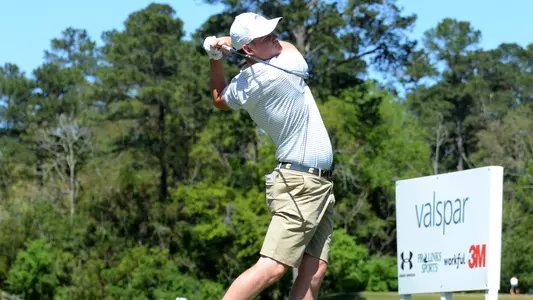 Paul Conroy fires a 7 iron at the flag in Augusta