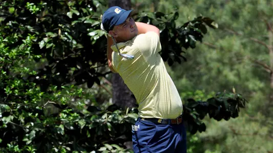 Paul Conroy tracks his approach to the green at SoCon Round 2