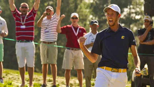 The crowd roars behind a jubilant Steven Fox as his winning putt drops for the 2012 U.S. Amateur title.
