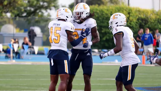 Josh Battle celebrates his 1st career interception with Kam Brown.at EIU