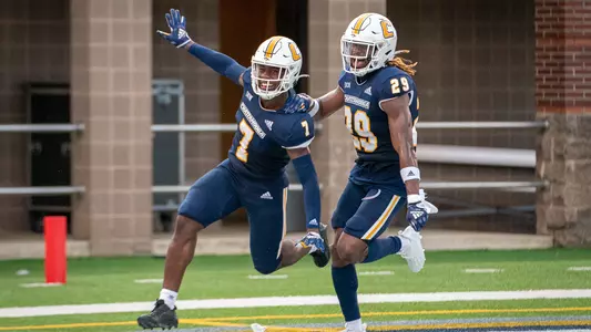 Reuben Lowery celebrates his first career pick 6 with Telly Plummer.