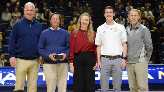 Jonathan Boyd is honored at a basketball timeout for being the 2023 Dayle May Award winner on the men's side.