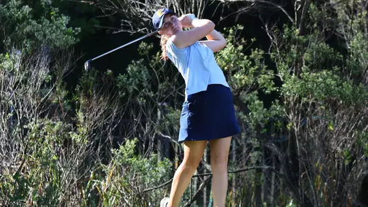 Makenzie Cooper stares down her iron shot at Old Dominion