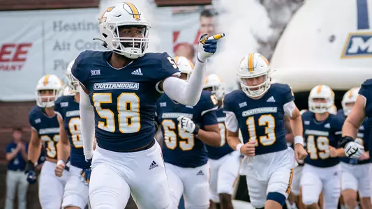 Marquise Freeman points to something as he enters the field pre-game against Kennesaw State