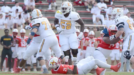 Almarion Crim flattens a VMI defender in the Mocs 2023 win at the Keydets