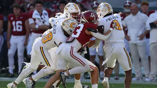 Defense gang tackles an Alabama runner in 2023 visit to Tuscaloosa