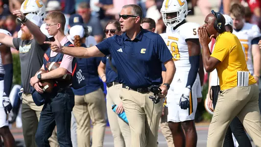 Coach Rusty Wright makes a point on the sideline during the win at Samford