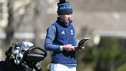 Dorota Zalewska checks her yardage book planning her next shot