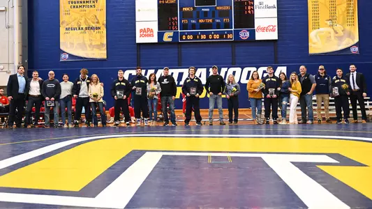 Wrestling Senior Day honorees with their families and coaches