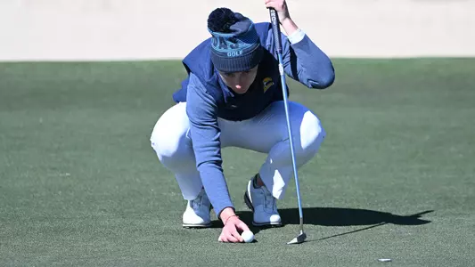 Dorota Zalewska places her ball on the green as she prepares to putt at Tulane