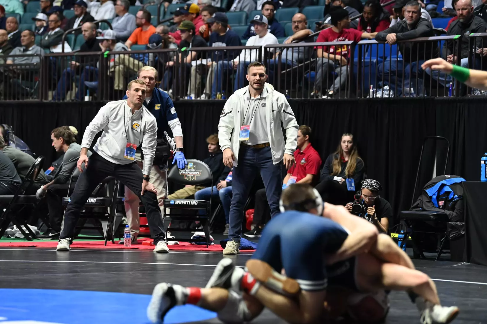 Head coach Kyle Ruschell and assistant coach Hunter Gamble at the NCAA Wrestling Championships.