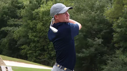 John Houk follows his ball flight during a practice round