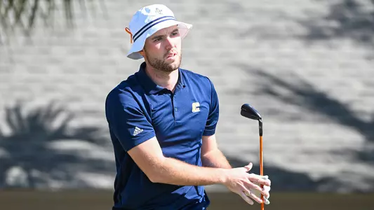 Samuel Espinosa follows his shot intently at Sawgrass Country Club