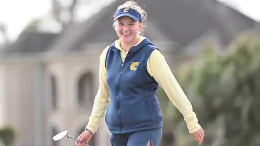 Carolina Hortian smiles for the camera coming off the green at Tulane