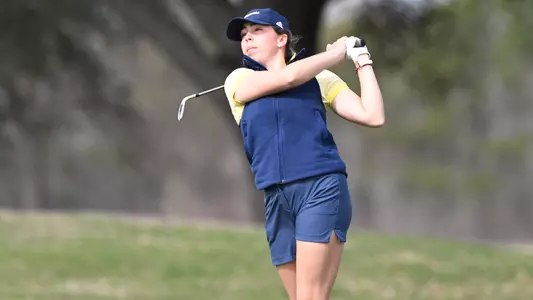 Nieves Martin closely tracks her shot from the fairway at Tulane.