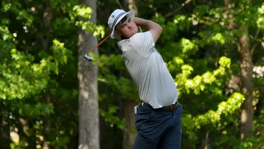 Paul Conroy finishes his tee shot in round one of the SoCon Championships