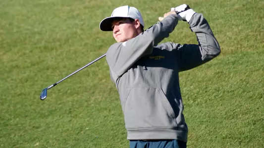 John Houk follows his tee shot at the J.T. Poston Invitational.
