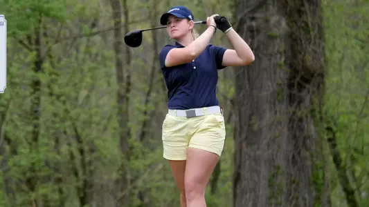 Kera Healey follows her tee shot off No. 8 at Council Fire