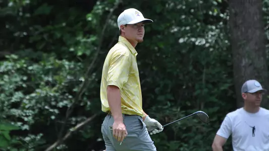 John Houk admires his drive walking back to his bag at the NCAA Auburn Regionals