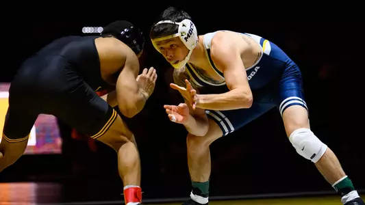 Logan Ashton looks for an opening is his match win over Iowa