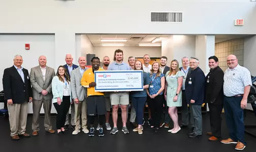 Food City and UTC representatives attend an event Thursday, May 25 in the Brenda Lawson Student-Athlete Success Center to announce that Food City will be funding a Fueling Station featuring healthy food options for athletes.