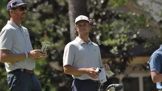Garrett Engle and Coach Blaine Woodruff share a lighter moment waiting to tee off on a par 3 at SoCon Championships