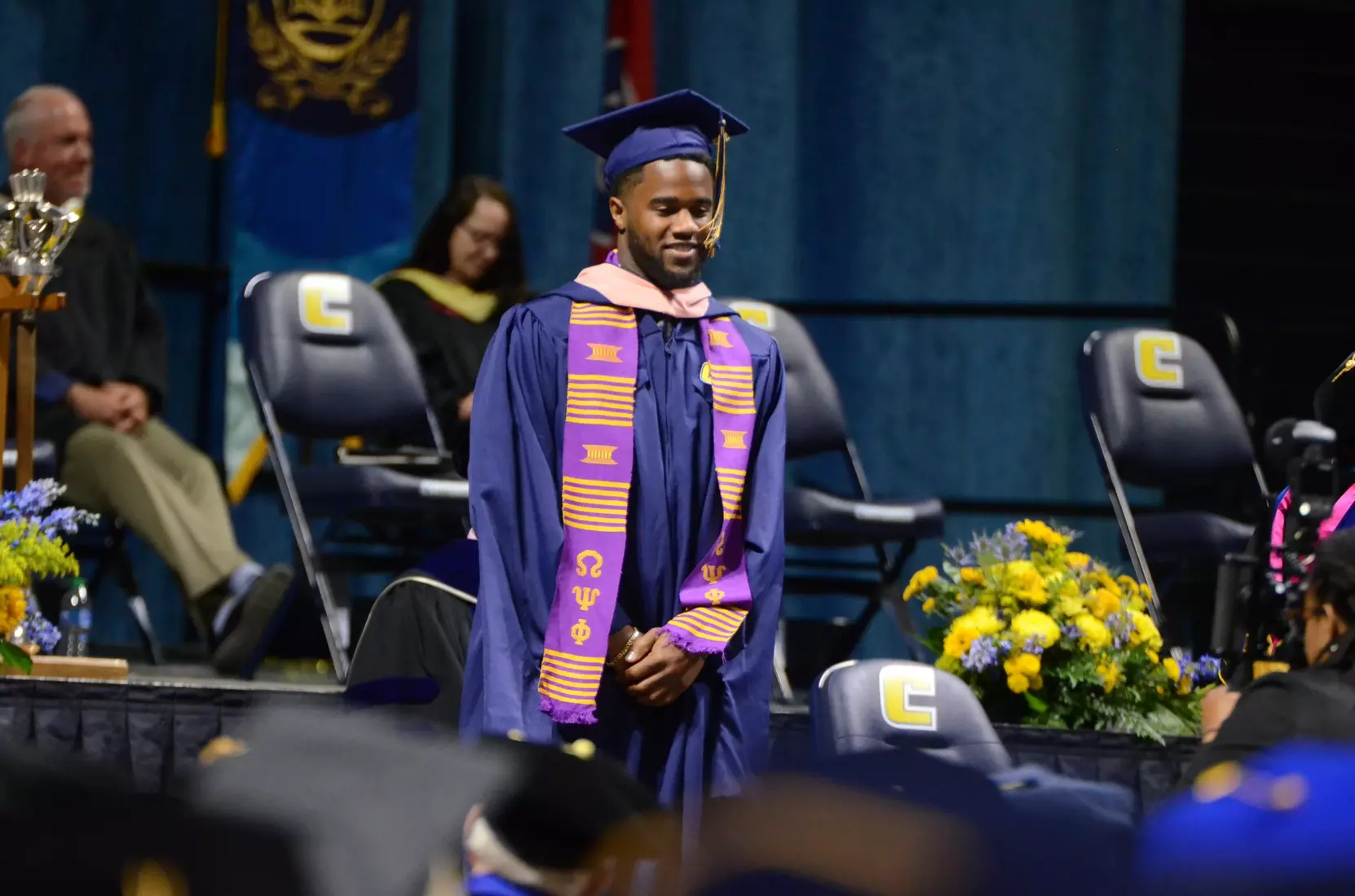 Football graduate Tyron Arnett earned his Master's Degree in Public on Friday.