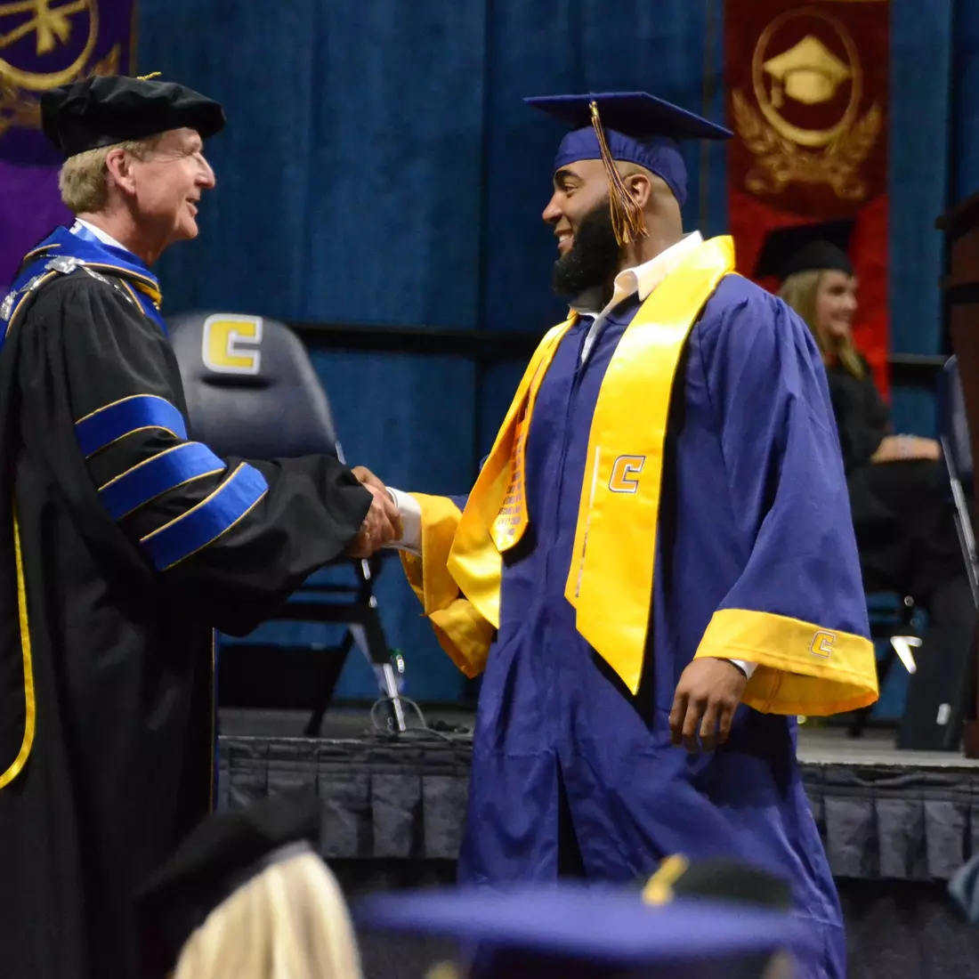 Dr. Angle with 2022 All-American and SoCon Football Defensive Player of the Year Jay Person who just earned his degree in SORT Management.