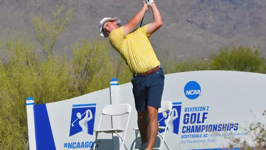 Paul Conroy tees off with Arizona mountains in the background at the NCAA Championships