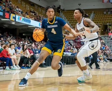 Sam Alexis dribbling against Wofford in the SoCon Tournament