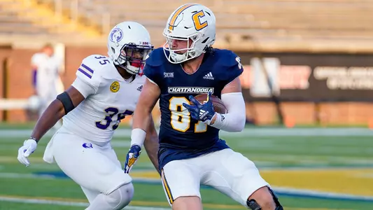 Jay Gibson looks to break a tackle after a catch in the North Alabama win