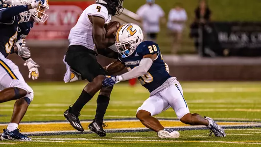 Jordan Walker makes a strong open field tackle in the win over Kennesaw State