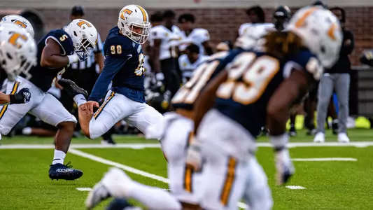 Clayton Crile sends another kickoff through the end zone.