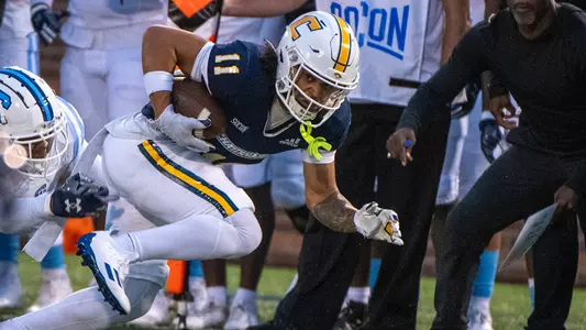 Sam Phillips runs down The Citadel sideline after a catch
