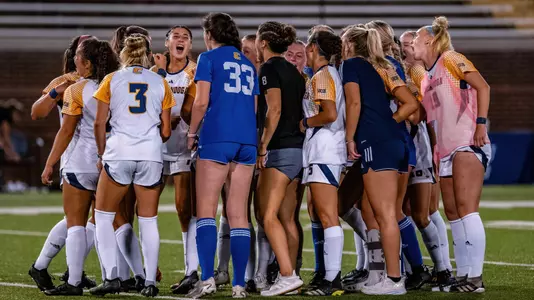 team huddle vs. Mercer