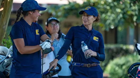 Coach Colette Murray has a laugh waiting on the tee with Carmen Belmonte at Vandy